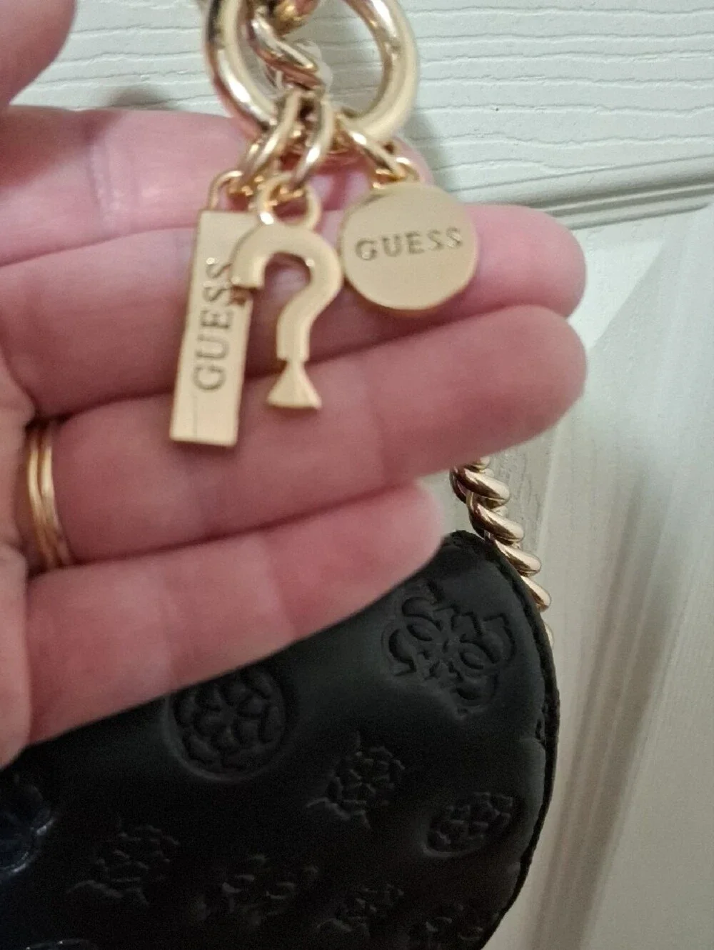 GUESS Black Embossed Leather Shoulder Bag with Gold Chain and Charm Accent